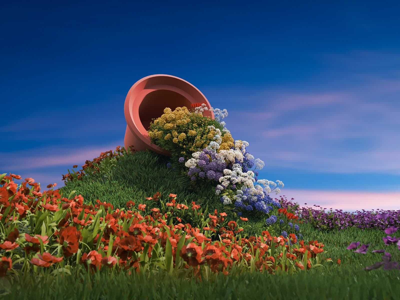 Omgevallen pot vol bloemen op een grasheuvel