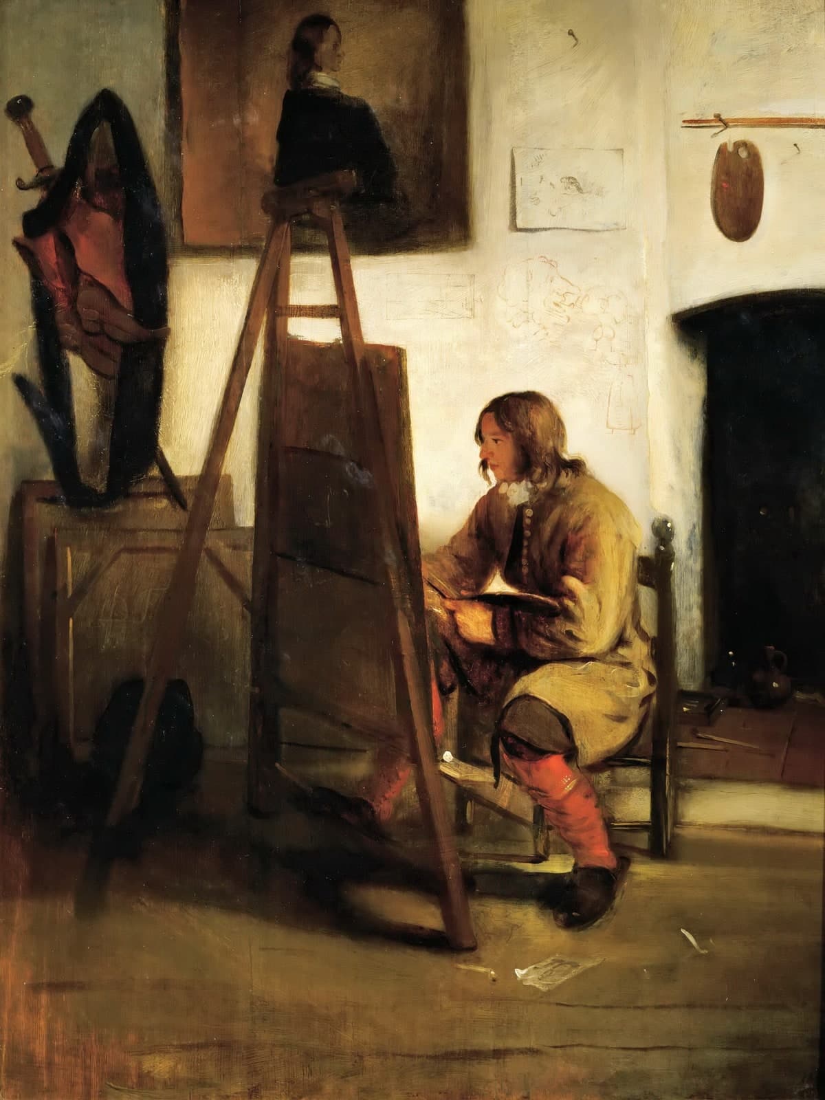 Jonge schilder in zijn atelier
