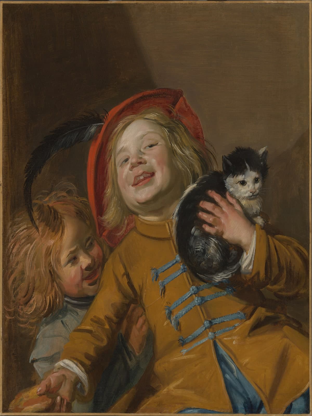 Twee kinderen met een kat
