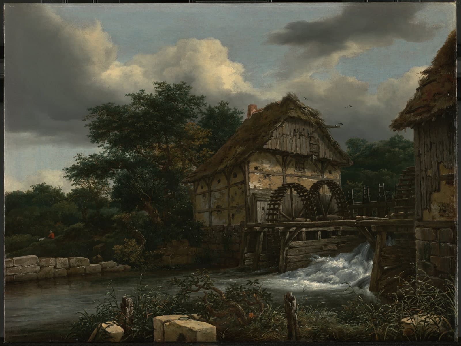 Twee watermolens en een open sluis