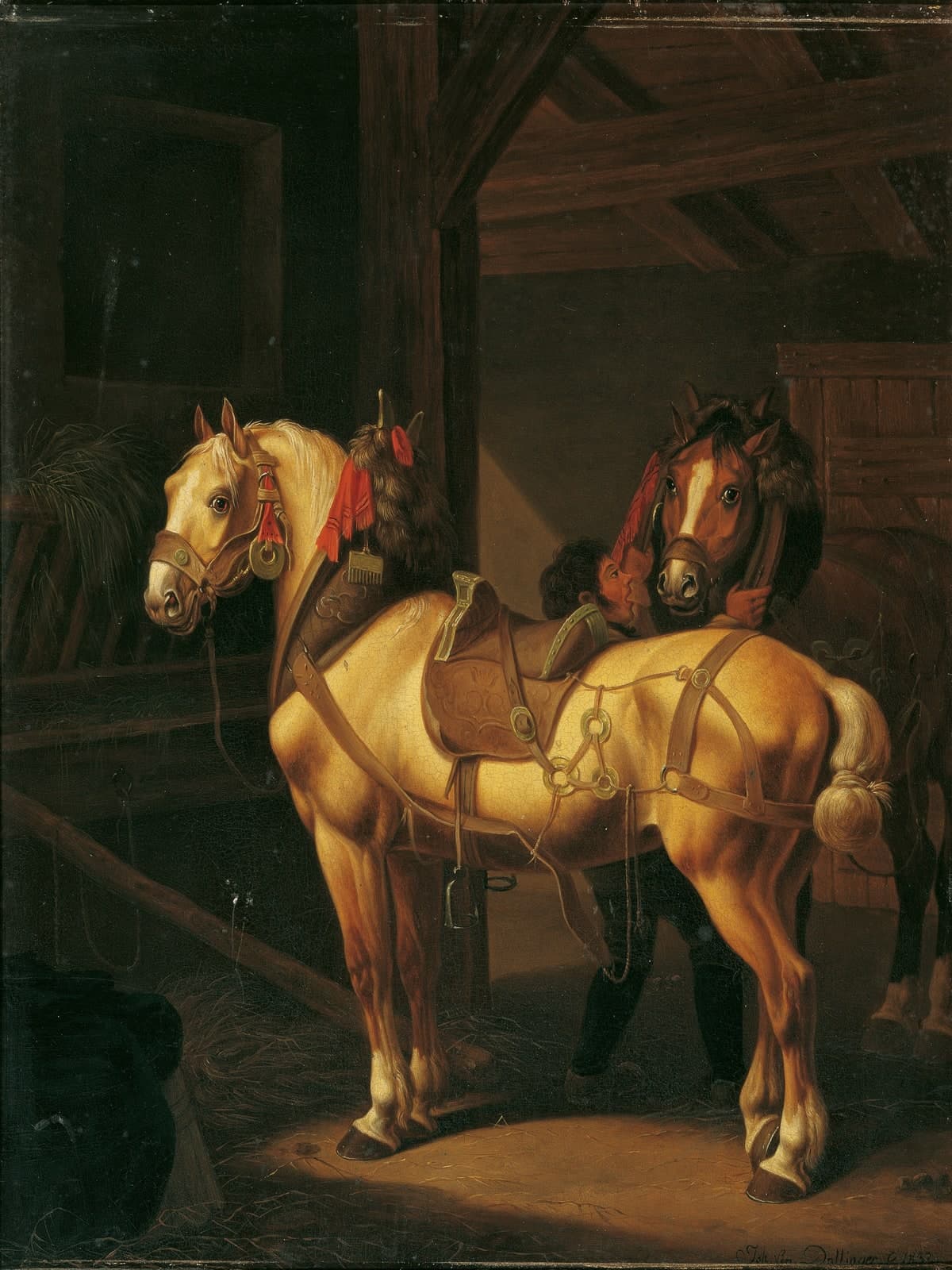 Twee trekpaarden in de stal