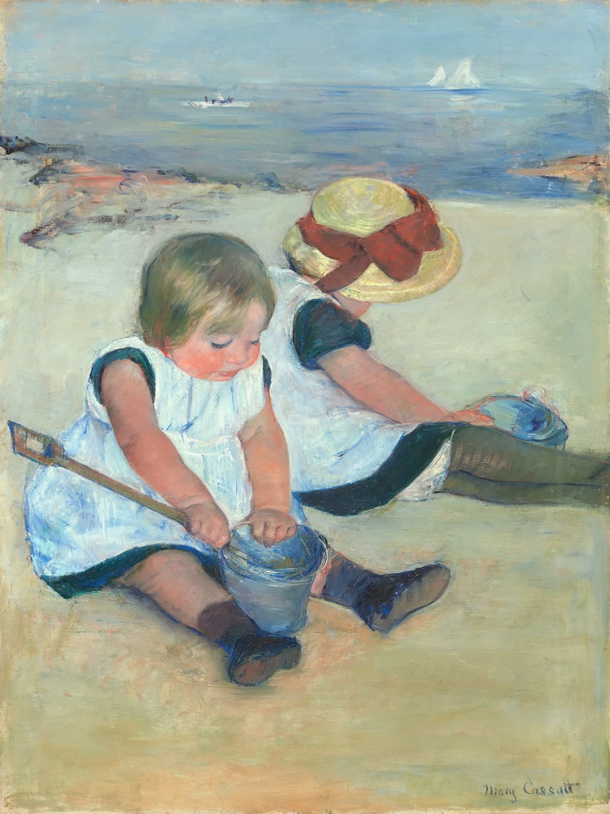 Kinderen spelend op het strand