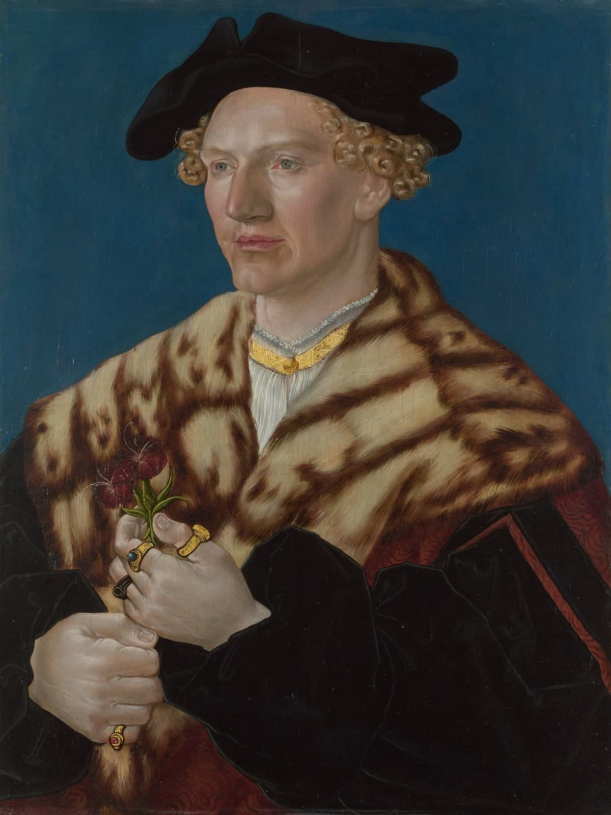 Portret van een man met rode bloemen
