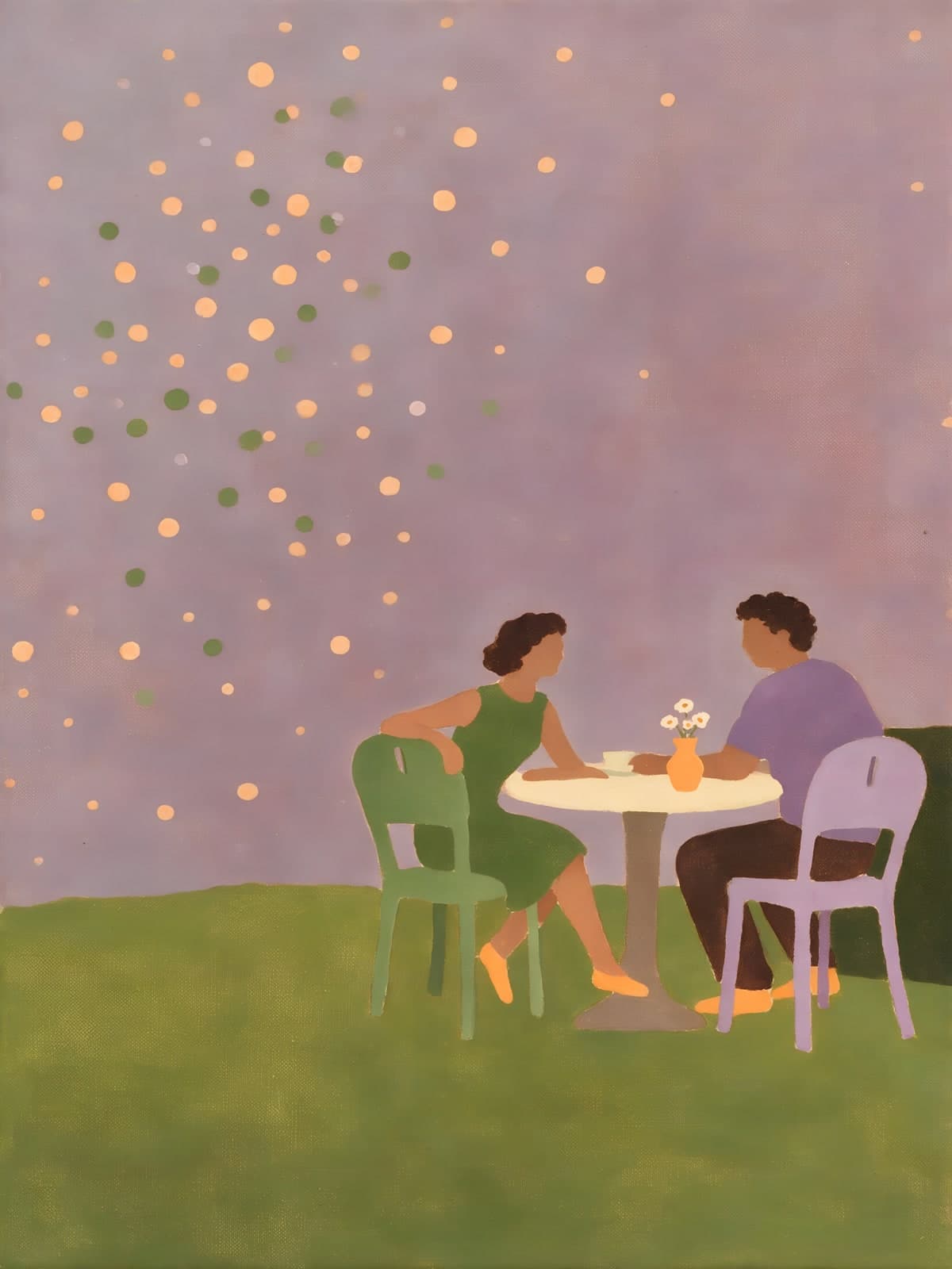 Twee mensen aan tafel onder oranje stippen
